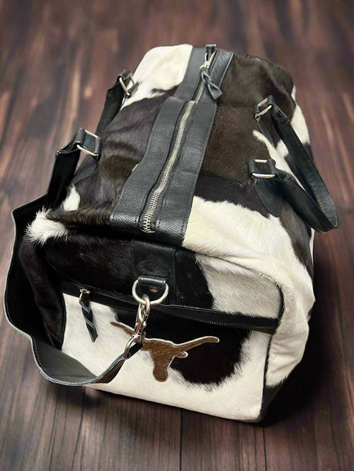 Black and White Longhorn Cowhide Duffle Bag - Cowhide and Conchos