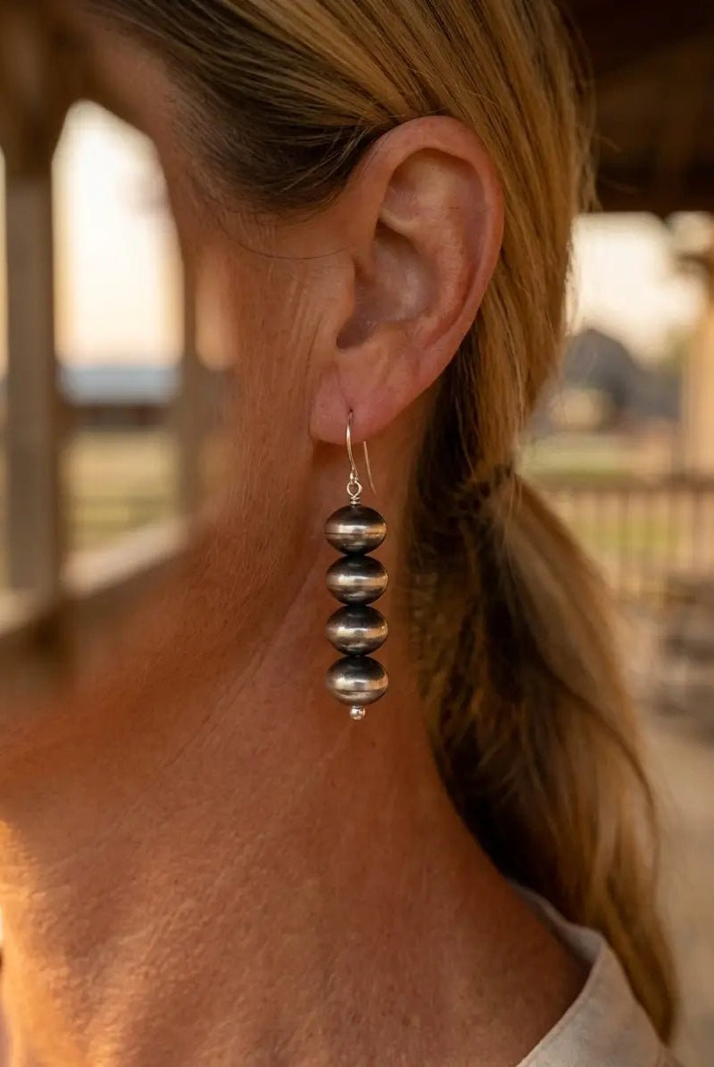 Bryannen Halwood Navajo Pearl Earrings — 2" Sterling Silver (Handcrafted by Navajo Artist) - Cowhide and Conchos