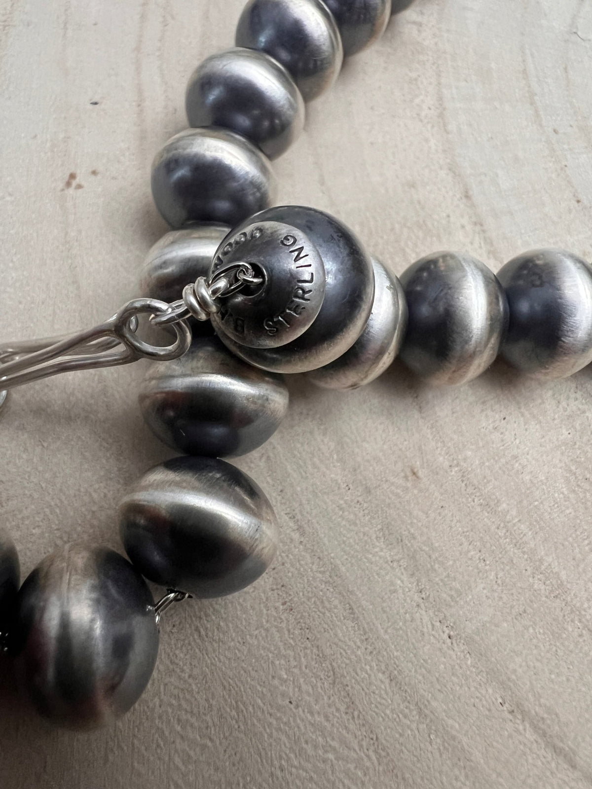 Bryannen Halwood Navajo Sterling Silver Handcrafted Navajo Pearl Necklace — 16" (10mm×13mm Beads, Heirloom) - Cowhide and Conchos