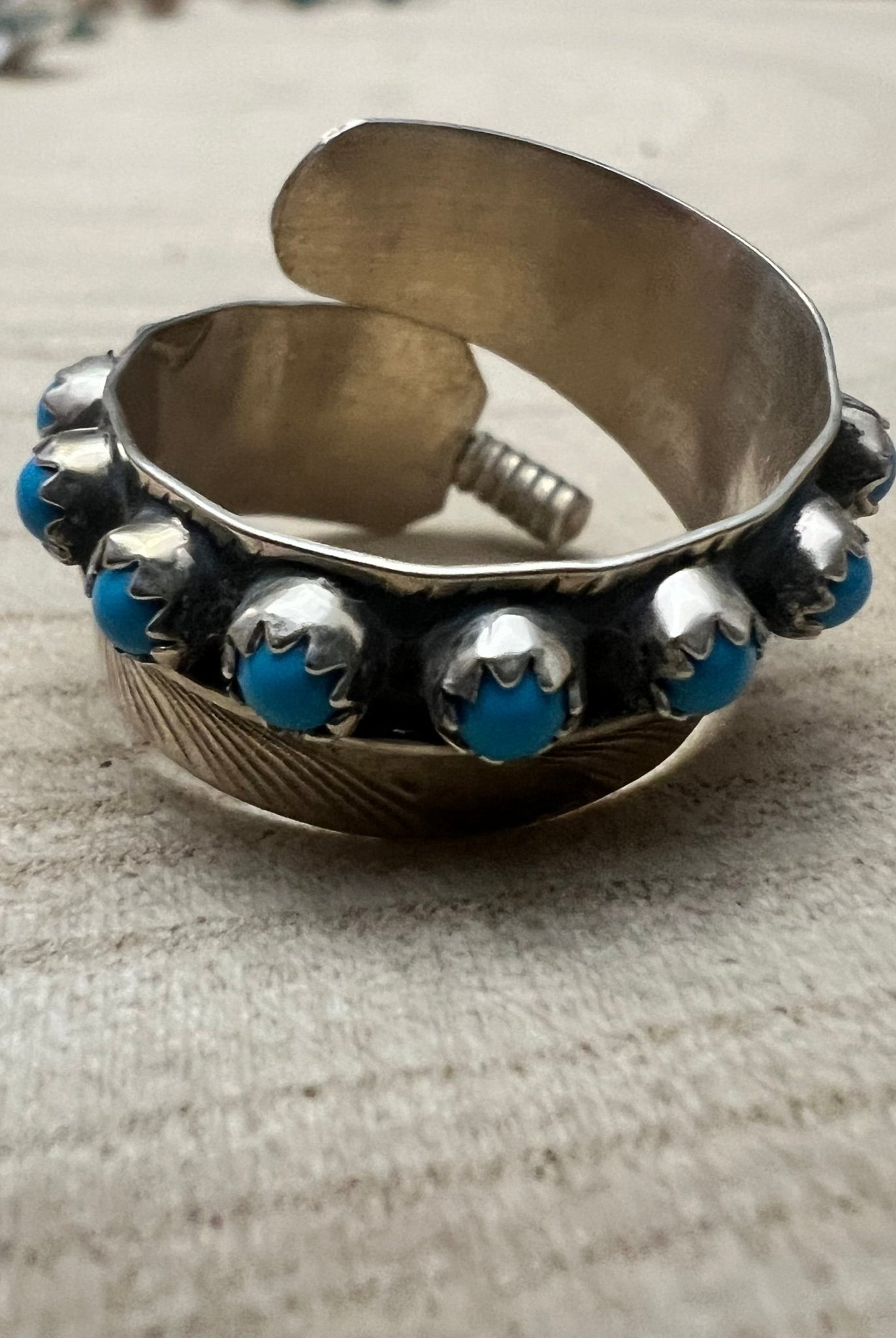 Chester Charley Navajo Handmade Kingman Turquoise Feather Adjustable Ring - Cowhide and Conchos