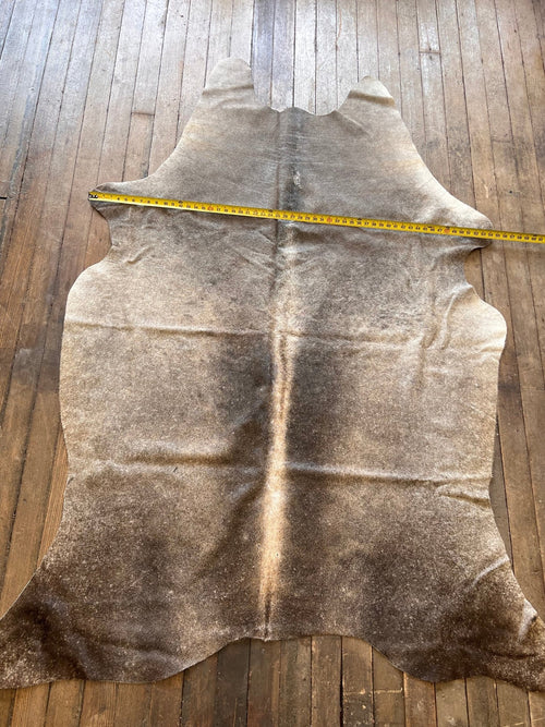 Cowhide Rug - 7' by 4.5' - Cowhide and Conchos