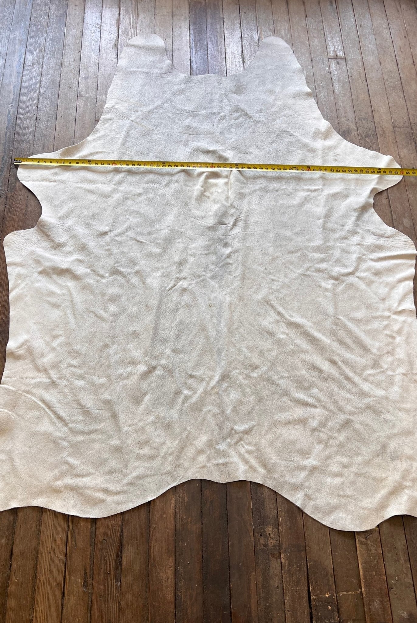 Cowhide Rug - 7' by 5' - Cowhide and Conchos