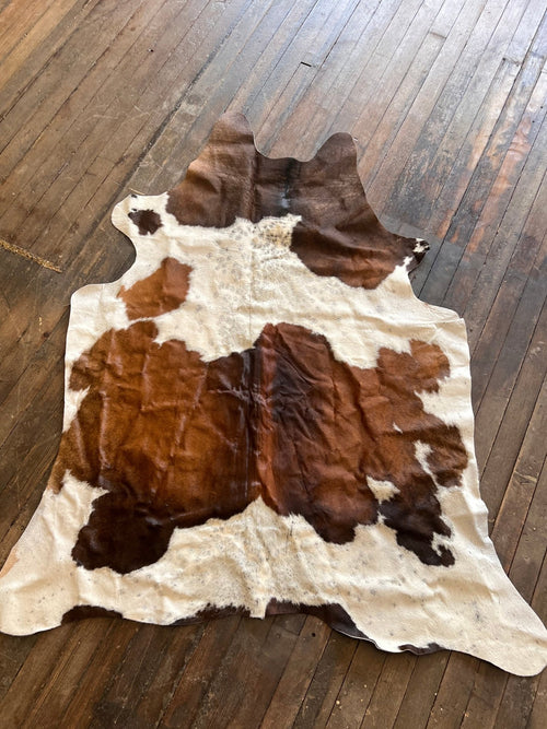 Cowhide Rug1 - 6.5 ft by 4.5 ft. - Cowhide and Conchos