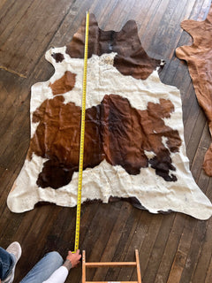 Cowhide Rug1 - 6.5 ft by 4.5 ft. - Cowhide and Conchos