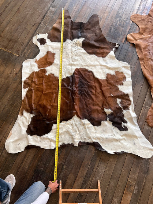 Cowhide Rug1 - 6.5 ft by 4.5 ft. - Cowhide and Conchos