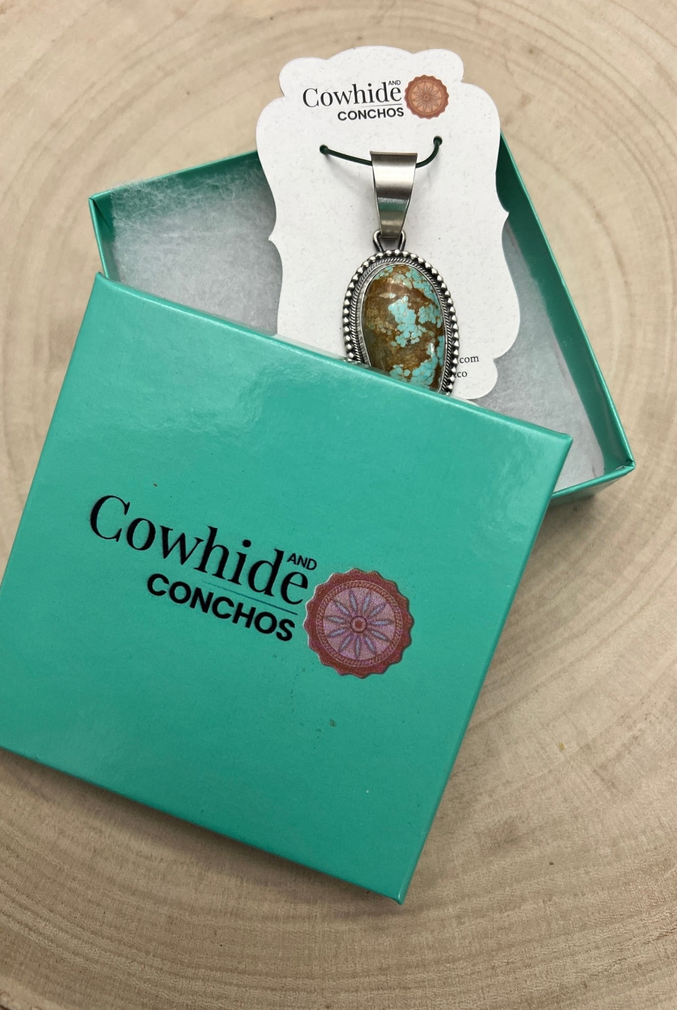 Daniel Benally Navajo Sterling Silver Pendant with 8 Mine Turquoise — 2 1/4" × 1" (Hallmark) - Cowhide and Conchos