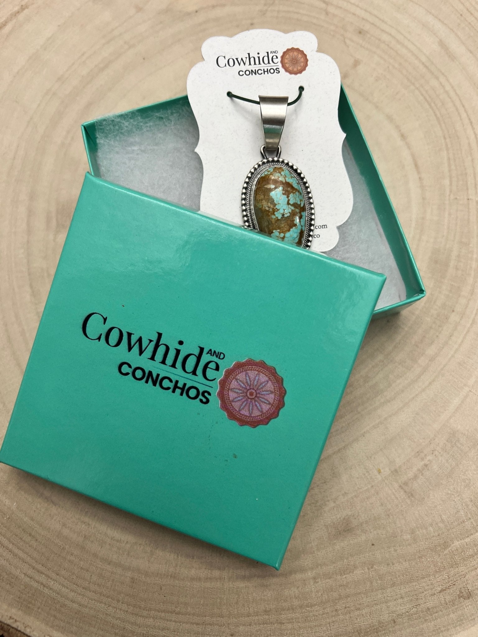 Daniel Benally Navajo Sterling Silver Pendant with 8 Mine Turquoise — 2 1/4" × 1" (Hallmark) - Cowhide and Conchos