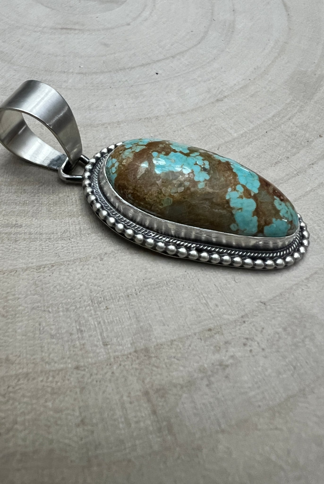Daniel Benally Navajo Sterling Silver Pendant with 8 Mine Turquoise — 2 1/4" × 1" (Hallmark) - Cowhide and Conchos