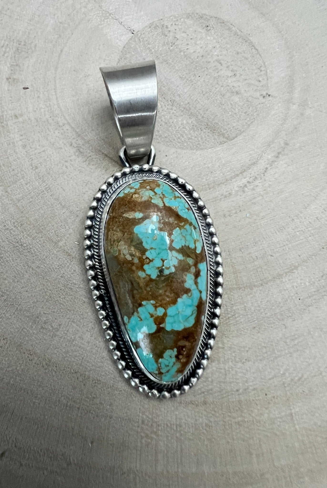 Daniel Benally Navajo Sterling Silver Pendant with 8 Mine Turquoise — 2 1/4" × 1" (Hallmark) - Cowhide and Conchos