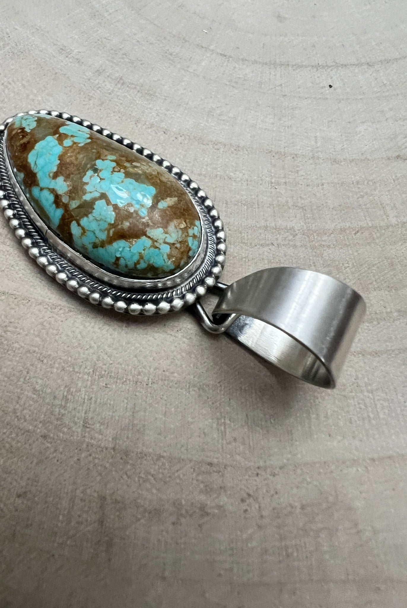 Daniel Benally Navajo Sterling Silver Pendant with 8 Mine Turquoise — 2 1/4" × 1" (Hallmark) - Cowhide and Conchos