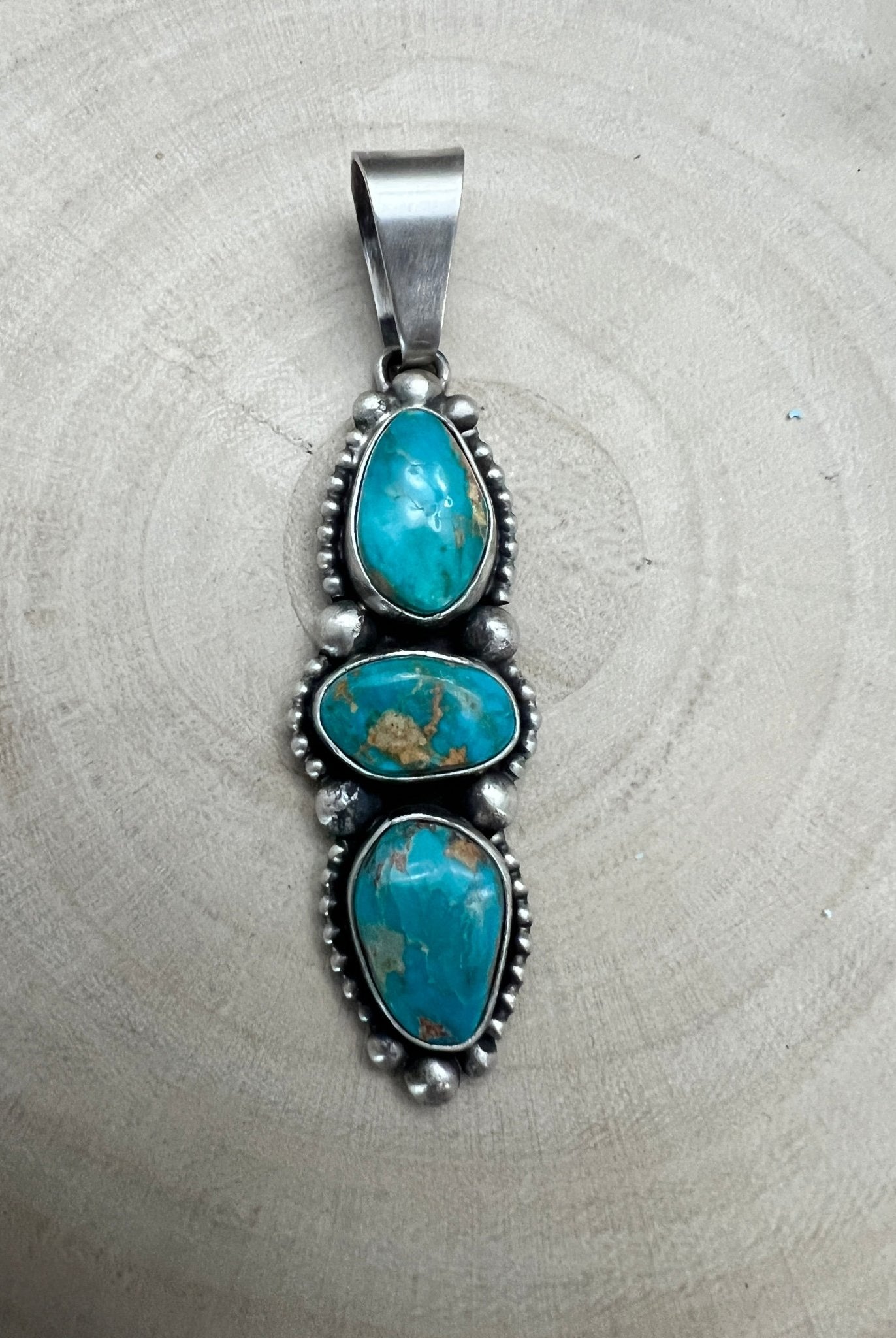 Darrin Livingston Navajo Sterling Silver Pendant with Natural Royston Turquoise — 3" × 3/4" (Hallmark) - Cowhide and Conchos