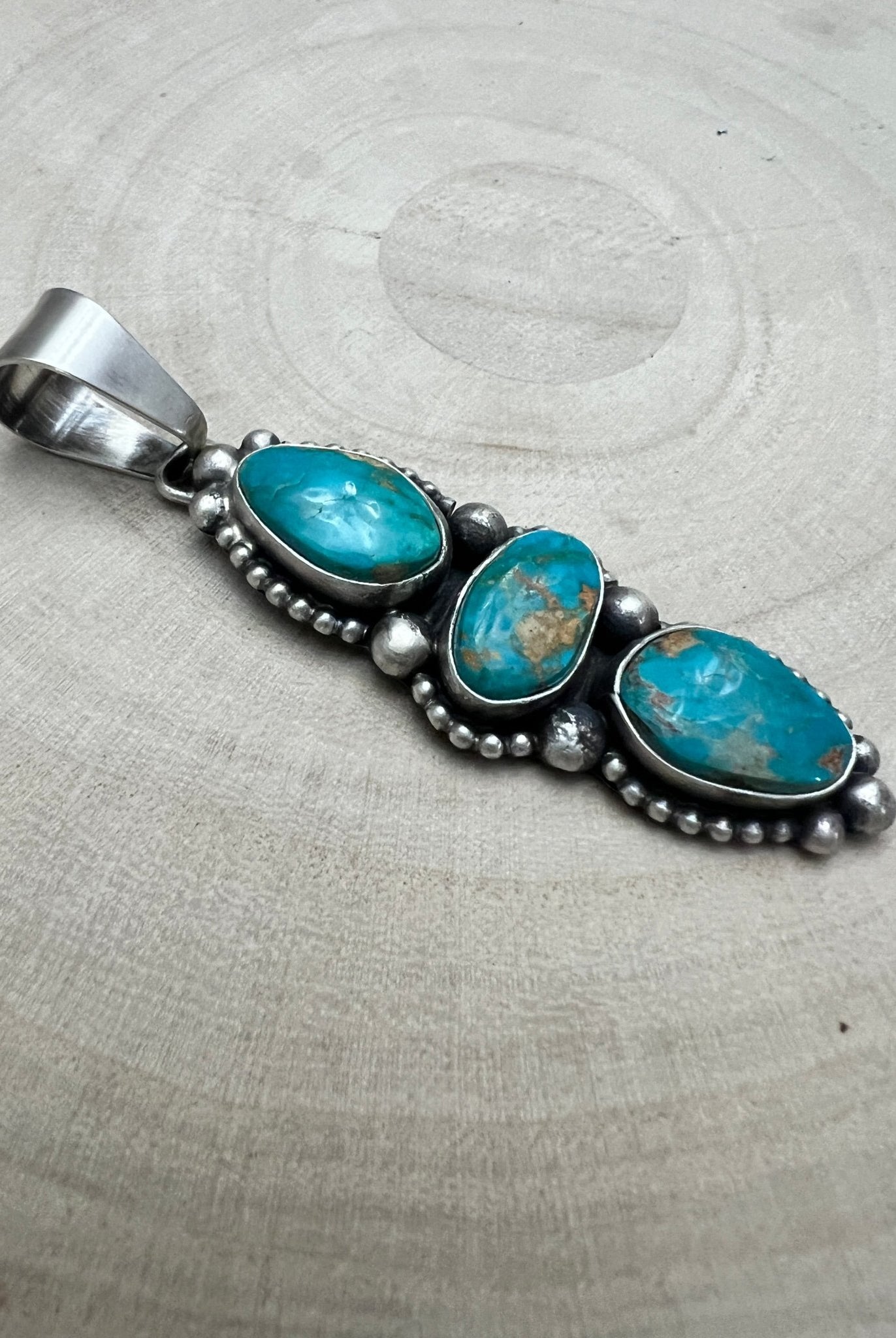 Darrin Livingston Navajo Sterling Silver Pendant with Natural Royston Turquoise — 3" × 3/4" (Hallmark) - Cowhide and Conchos
