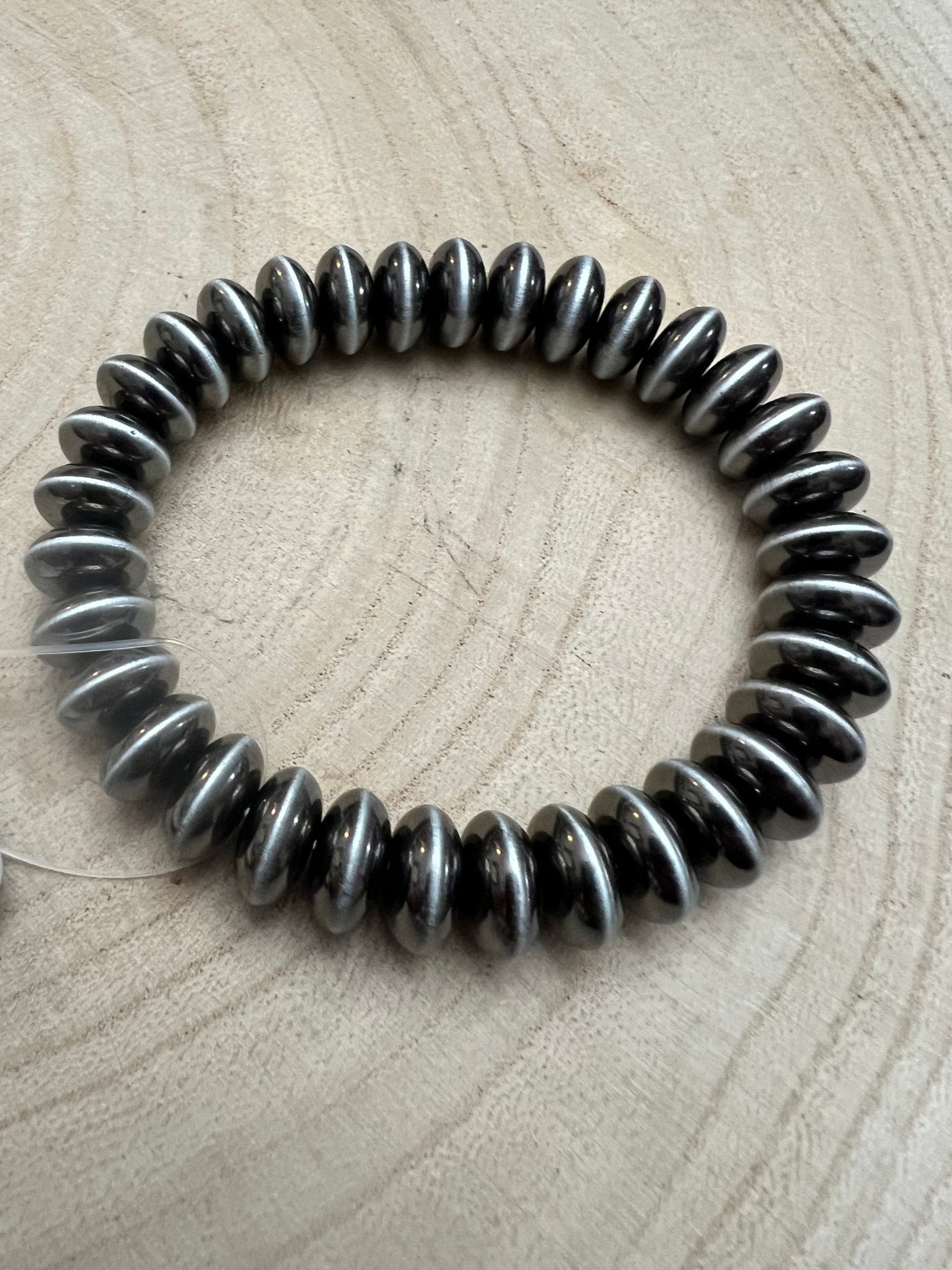 Faux Sterling Saucer Stretch Bracelet - 10 mm faux saucers - Cowhide and Conchos