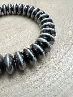 Faux Sterling Saucer Stretch Bracelet - 10 mm faux saucers - Cowhide and Conchos