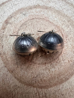 Handmade and stamped Navajo Pearl Earrings by Preston Haley - Cowhide and Conchos