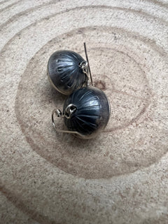 Handmade and stamped Navajo Pearl Earrings by Preston Haley - Cowhide and Conchos