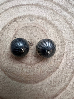 Handmade and stamped Navajo Pearl Earrings by Preston Haley - Cowhide and Conchos