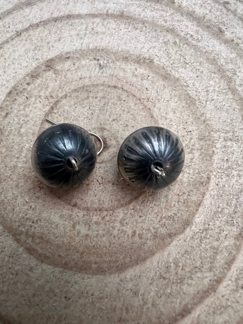 Handmade and stamped Navajo Pearl Earrings by Preston Haley - Cowhide and Conchos