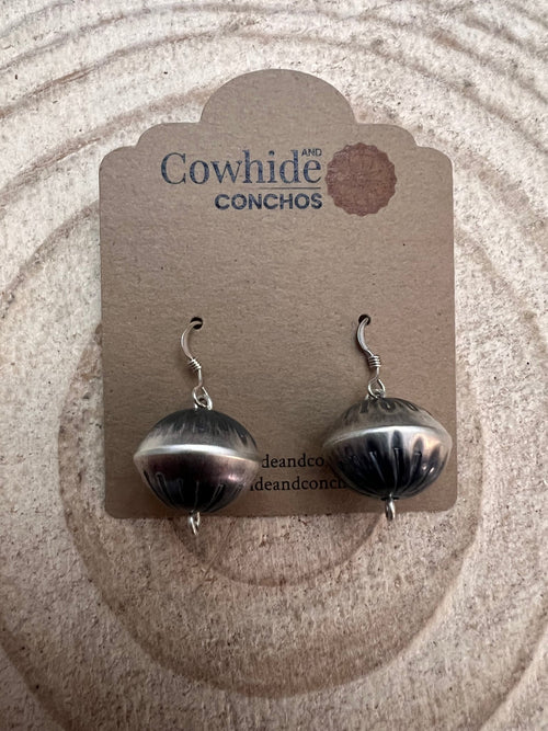 Handmade and stamped Navajo Pearl Earrings by Preston Haley - Cowhide and Conchos