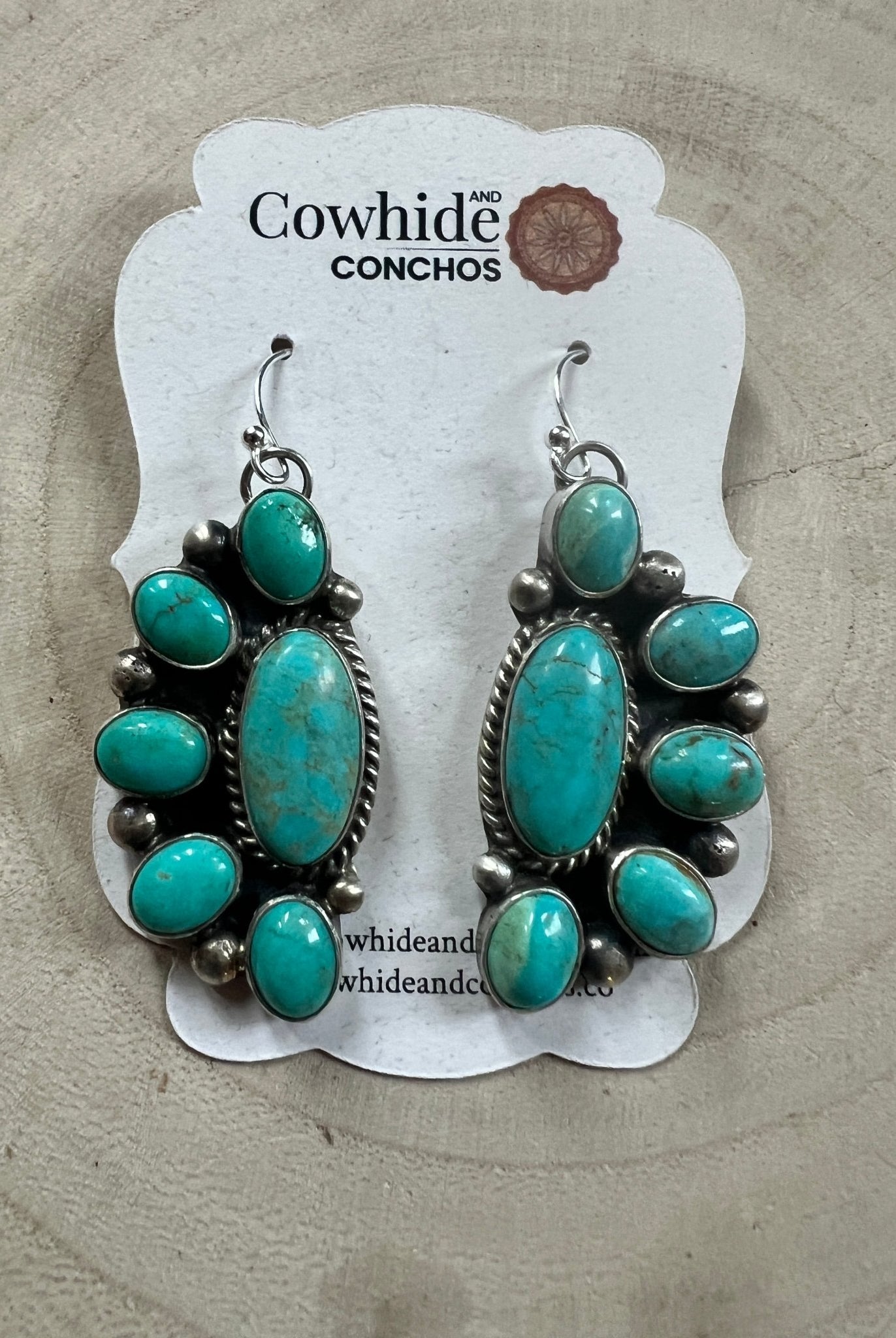 Kathleen Livingston Navajo Sterling Silver Earrings with Sonoran Gem Turquoise — 2" × 3/4" (Hallmarked) - Cowhide and Conchos