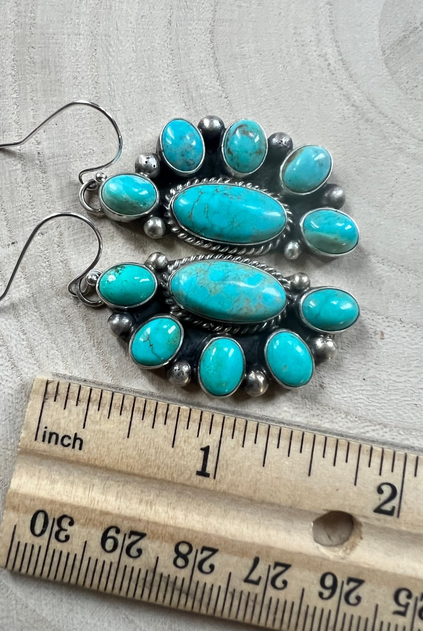 Kathleen Livingston Navajo Sterling Silver Earrings with Sonoran Gem Turquoise — 2" × 3/4" (Hallmarked) - Cowhide and Conchos