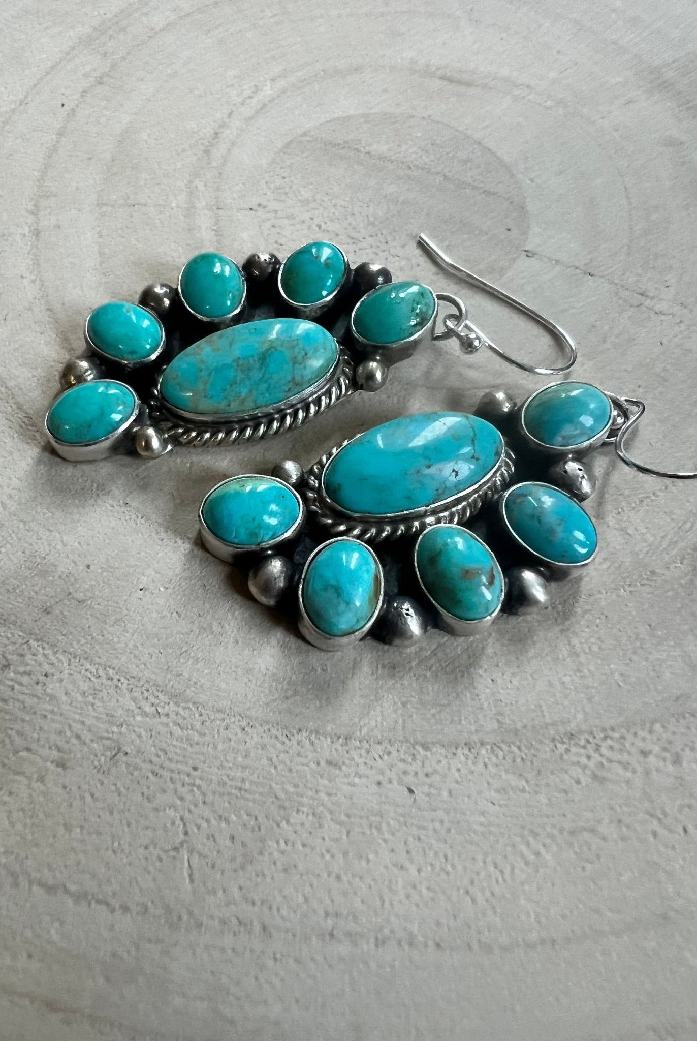 Kathleen Livingston Navajo Sterling Silver Earrings with Sonoran Gem Turquoise — 2" × 3/4" (Hallmarked) - Cowhide and Conchos