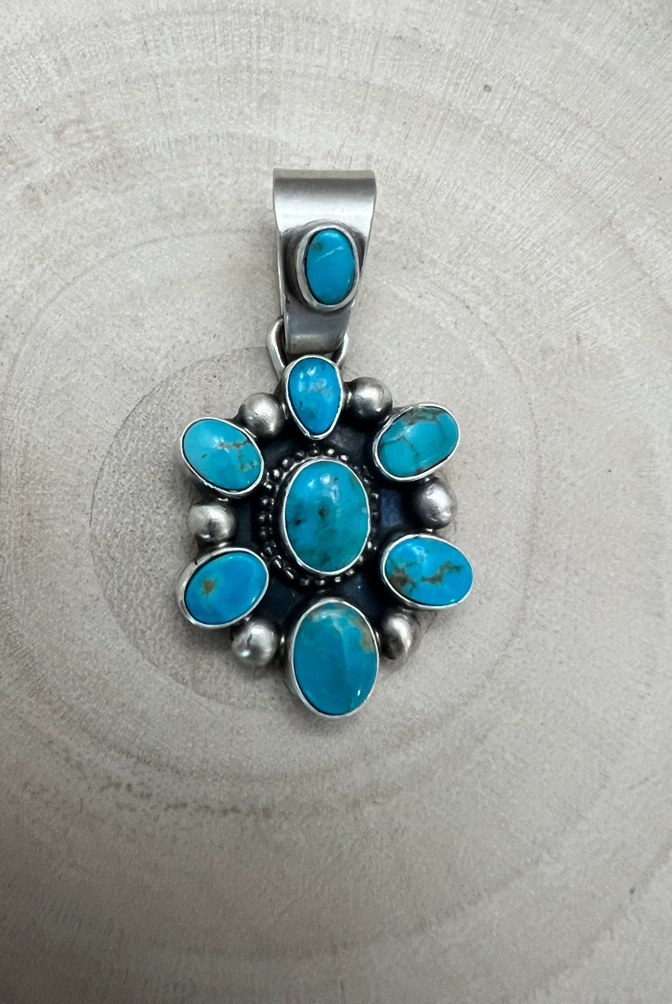 Kathleen Livingston Navajo Sterling Silver Pendant with Sonoran Gem Turquoise — 1 3/4" × 7/8" (Hallmark) - Cowhide and Conchos