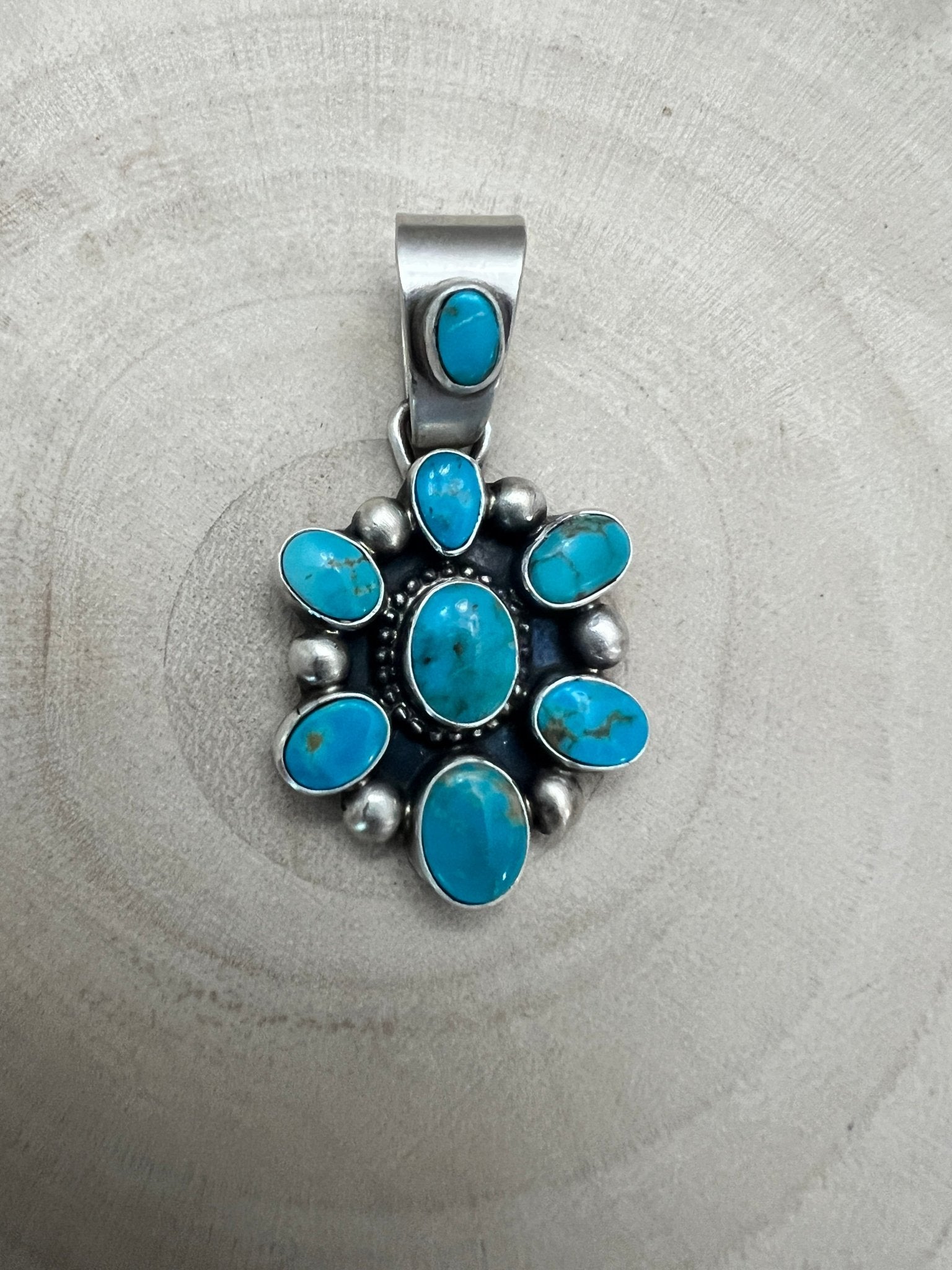 Kathleen Livingston Navajo Sterling Silver Pendant with Sonoran Gem Turquoise — 1 3/4" × 7/8" (Hallmark) - Cowhide and Conchos