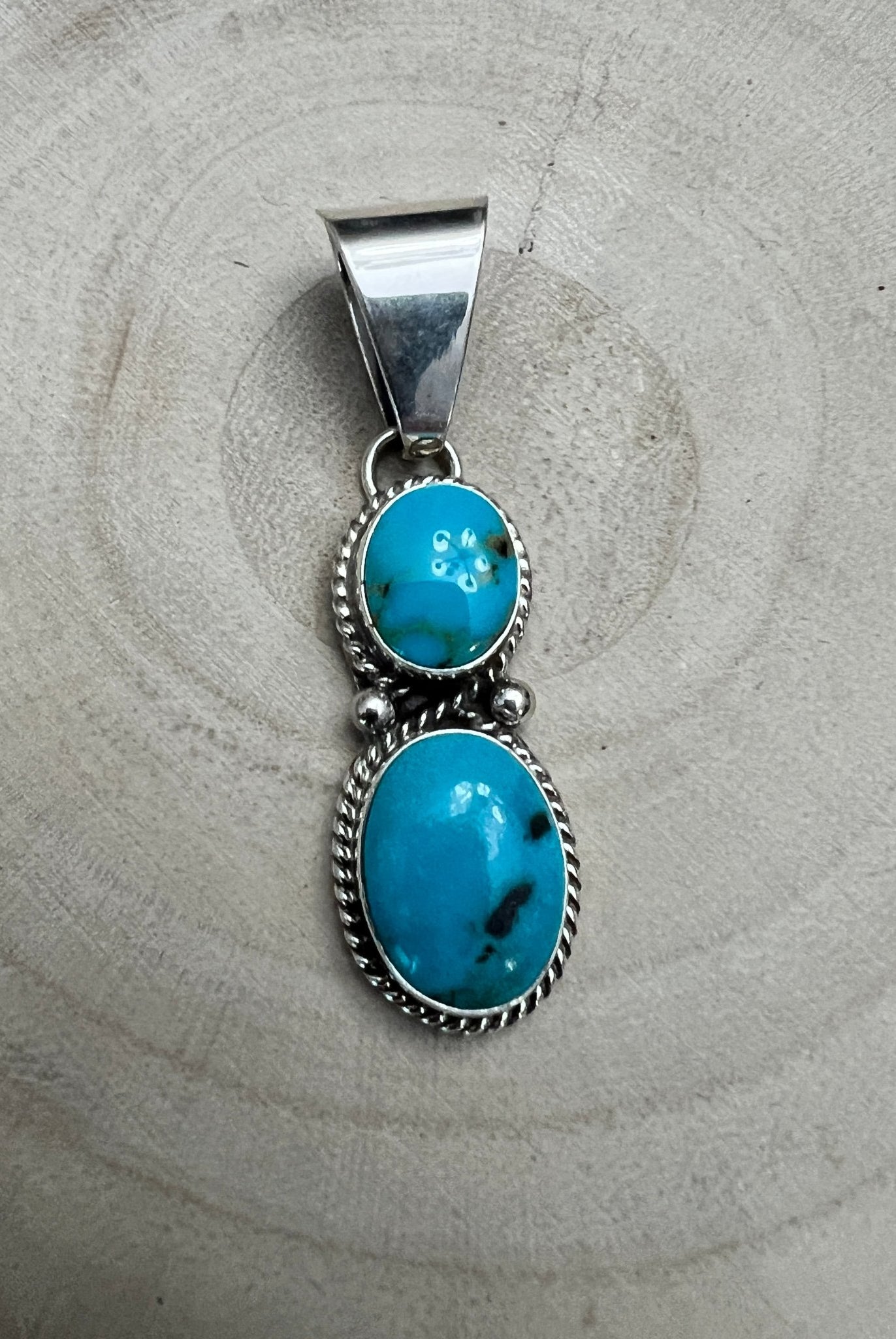 Kathleen Livingston Navajo Sterling Silver Pendant with Sonoran Gem Turquoise — 2" × 1/2" (Hallmarked) - Cowhide and Conchos