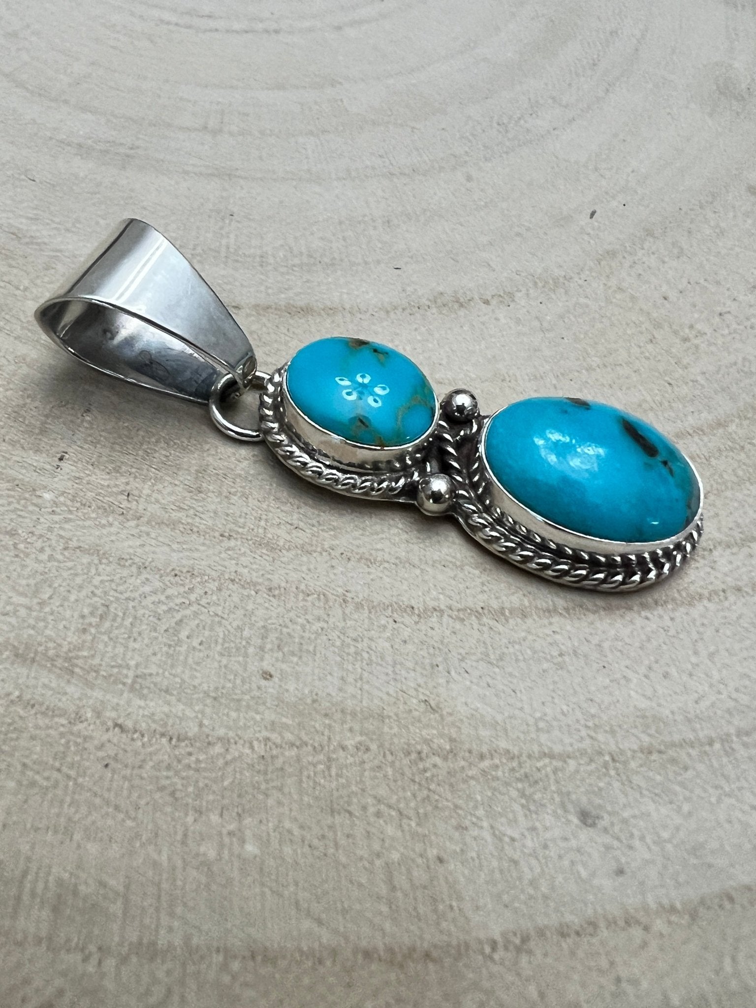 Kathleen Livingston Navajo Sterling Silver Pendant with Sonoran Gem Turquoise — 2" × 1/2" (Hallmarked) - Cowhide and Conchos