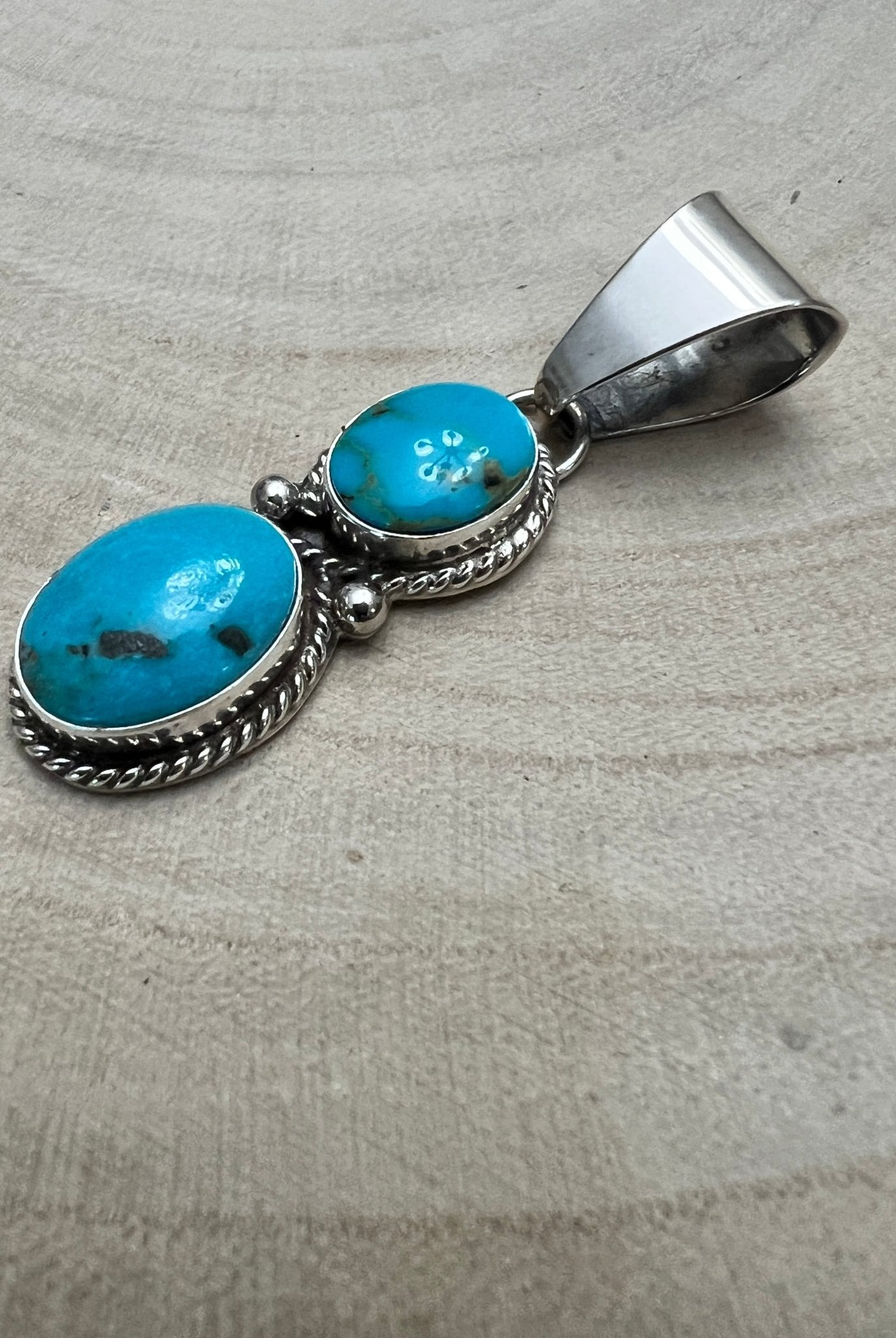 Kathleen Livingston Navajo Sterling Silver Pendant with Sonoran Gem Turquoise — 2" × 1/2" (Hallmarked) - Cowhide and Conchos