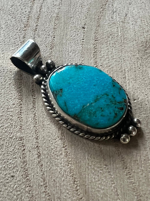 Rena Begay Turquoise & Sterling Silver Pendant - Cowhide and Conchos