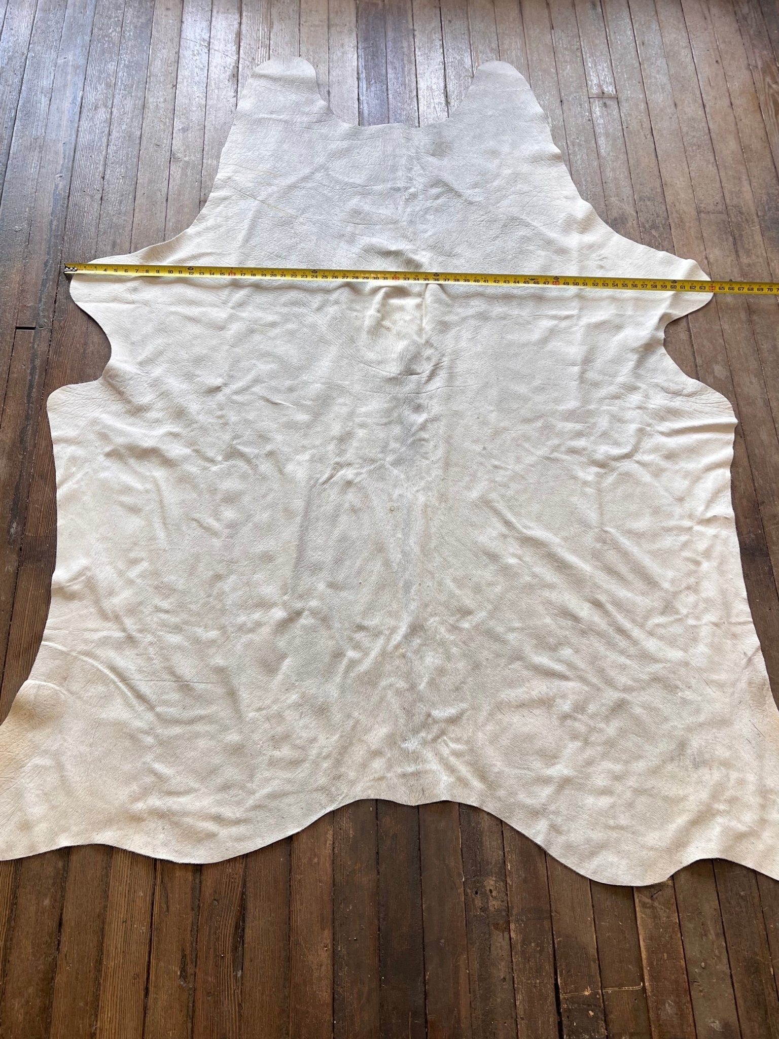 Cowhide Rug - 7' by 5' - Cowhide and Conchos
