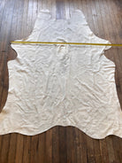 Cowhide Rug - 7' by 5' - Cowhide and Conchos