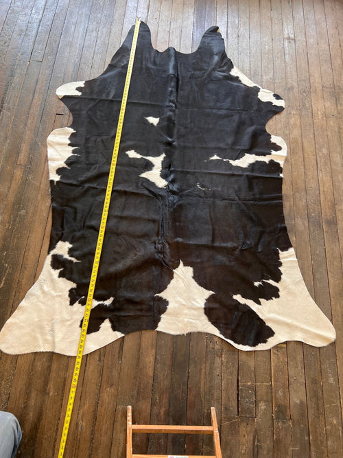 Cowhide Rug - 7.5' by 5' - Cowhide and Conchos