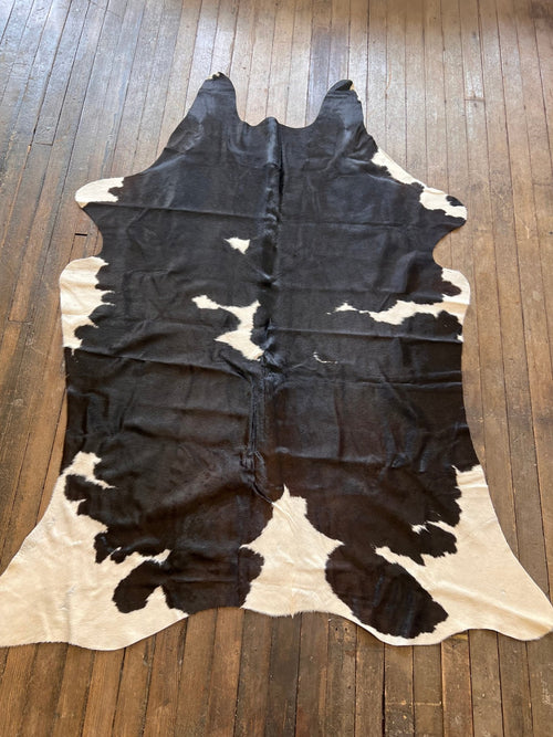 Cowhide Rug - 7.5' by 5' - Cowhide and Conchos