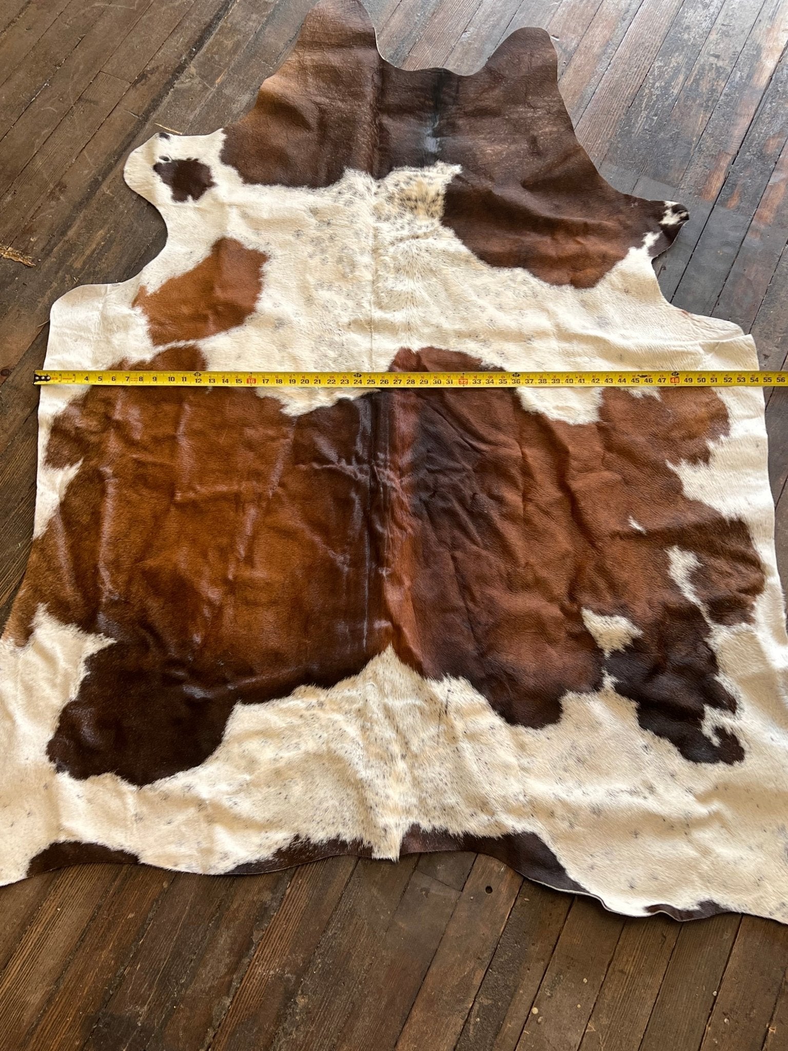 Cowhide Rug1 - 6.5 ft by 4.5 ft. - Cowhide and Conchos