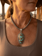 Daniel Benally Navajo Sterling Silver Pendant with 8 Mine Turquoise — 2 1/4" × 1" (Hallmark) - Cowhide and Conchos