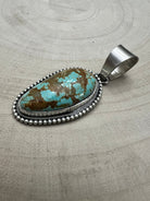 Daniel Benally Navajo Sterling Silver Pendant with 8 Mine Turquoise — 2 1/4" × 1" (Hallmark) - Cowhide and Conchos