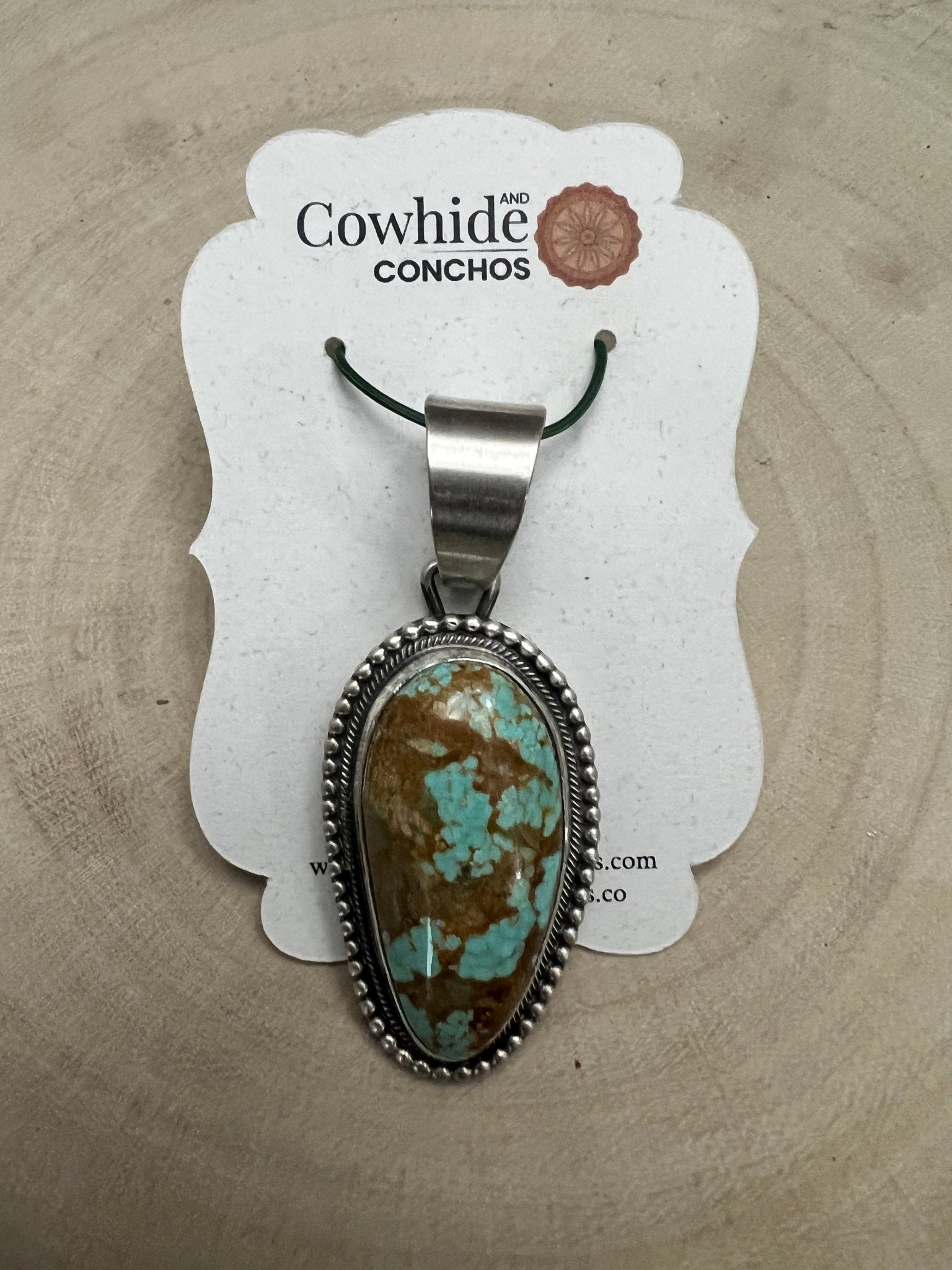 Daniel Benally Navajo Sterling Silver Pendant with 8 Mine Turquoise — 2 1/4" × 1" (Hallmark) - Cowhide and Conchos