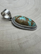 Daniel Benally Navajo Sterling Silver Pendant with 8 Mine Turquoise — 2 1/4" × 1" (Hallmark) - Cowhide and Conchos