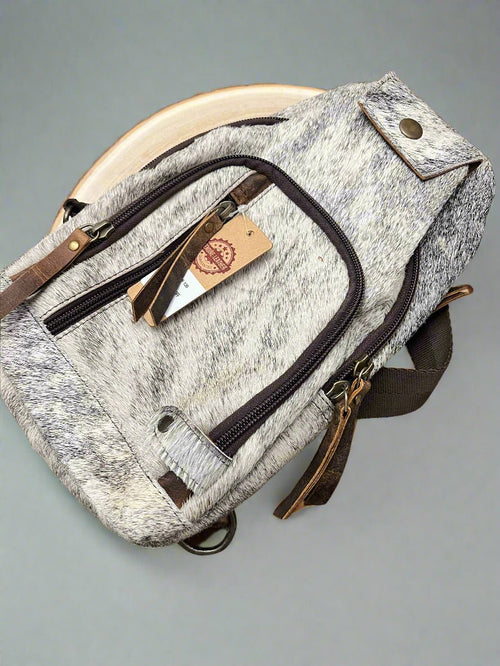 Genuine Hair on Hide Sling Bag - Cowhide and Conchos