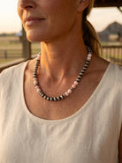 Close-up of the Cowhide & Conchos 8mm Pearl, Saucer & Pink Conch Necklace — sterling saucers and pink conch detail, elegant statement.