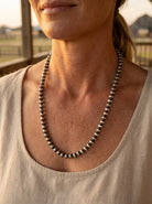 Close-up of the Cowhide & Conchos Dorinda Mariano Navajo Pearl Necklace — authentic 6mm sterling silver beads, maker's-stamped heirloom.