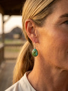 Close-up of the Eugene Gruber Navajo Sonoran Turquoise Earring — sterling silver and Sonoran turquoise detail in warm light.