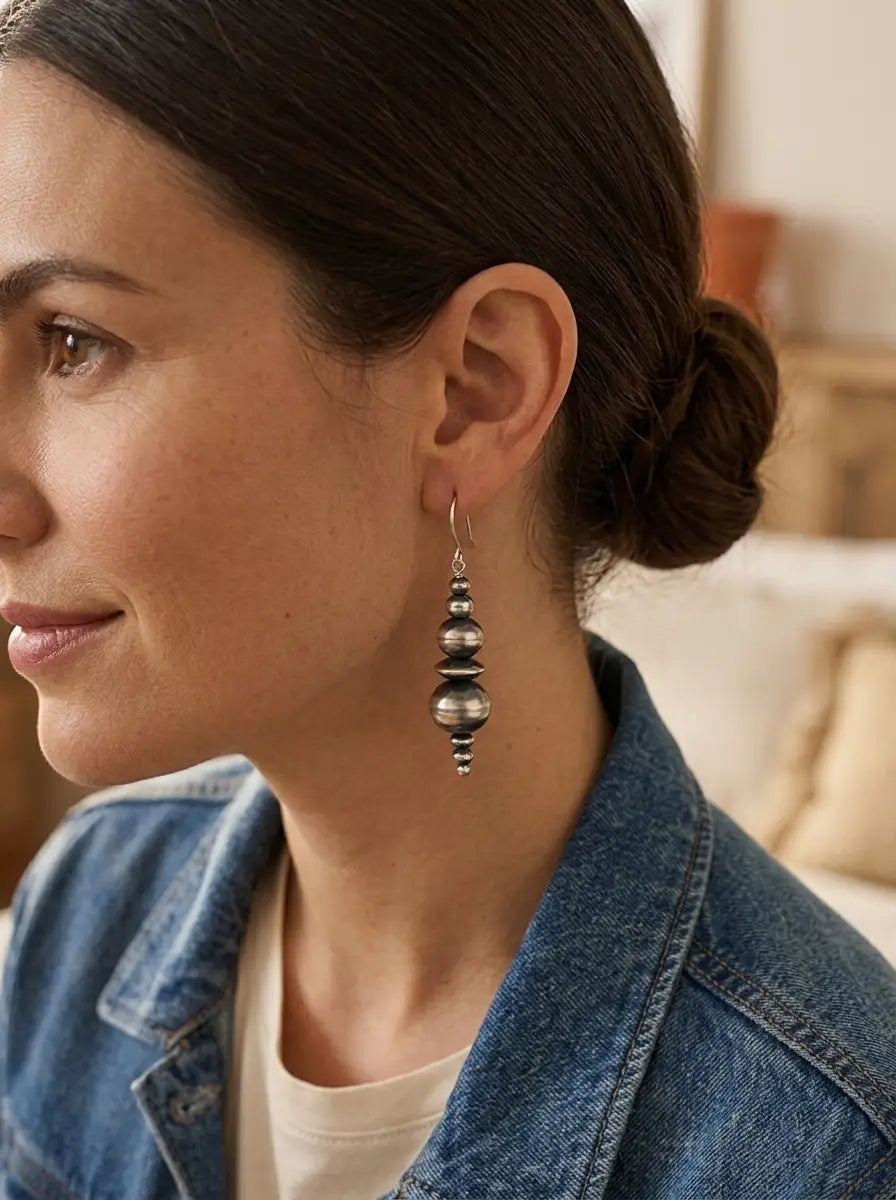 Close-up of the Dorinda Mariano Navajo Pearl Earring — handcrafted sterling silver beadwork in soft golden light.