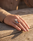 Close-up of the Cowhide & Conchos coral and mother-of-pearl sterling silver flower-style ring — up close.
