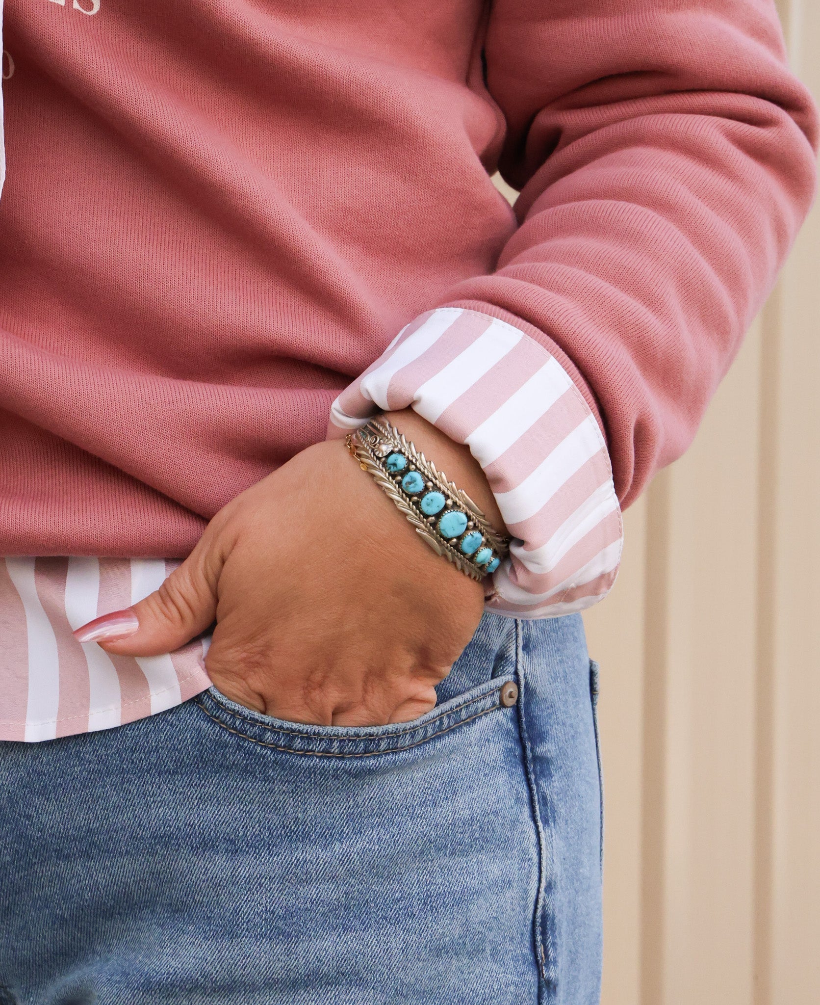 Anthony Brown Navajo handcrafted sterling silver cuff bracelet with Kingman turquoise, worn with denim