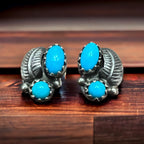 Petite Turquoise post earrings with sterling silver leaf - top view