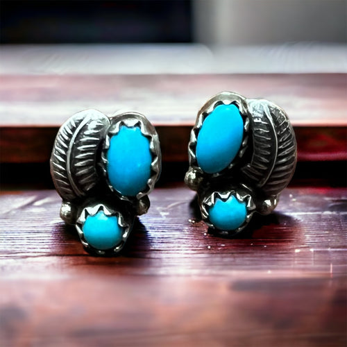 Petite Turquoise post earrings with sterling silver leaf - front view
